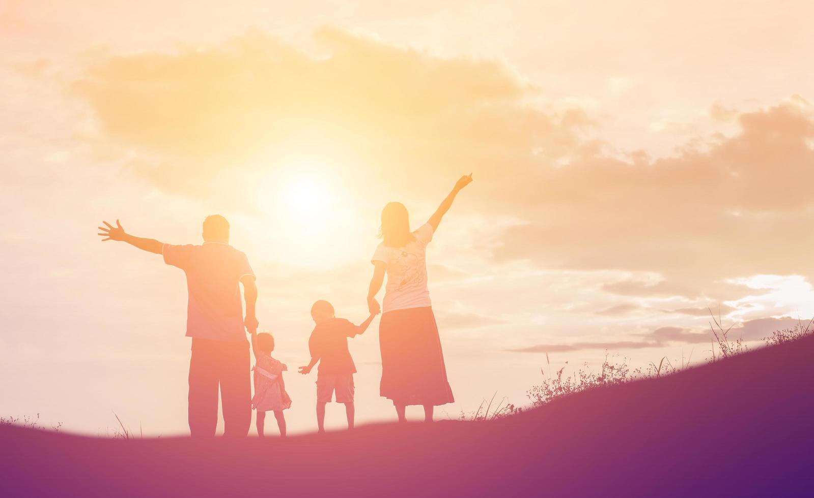 Happy family dancing on the road in the sunset time. Evening party on the nature photo