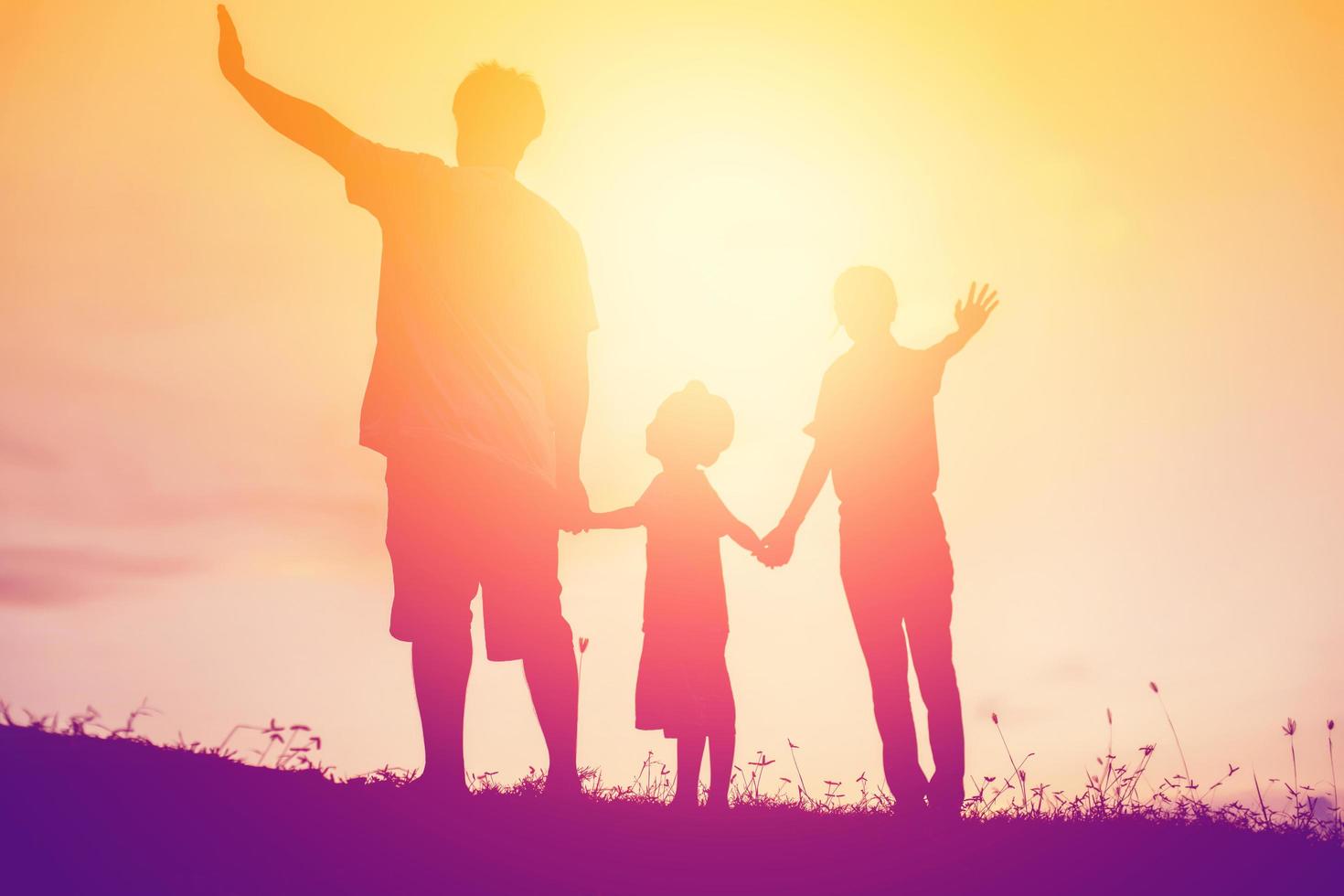 silhouette of a happy family and happy time sunset photo