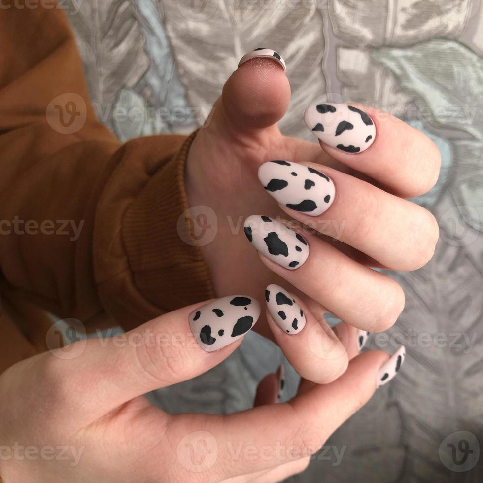 Female manicure with leopard design photo
