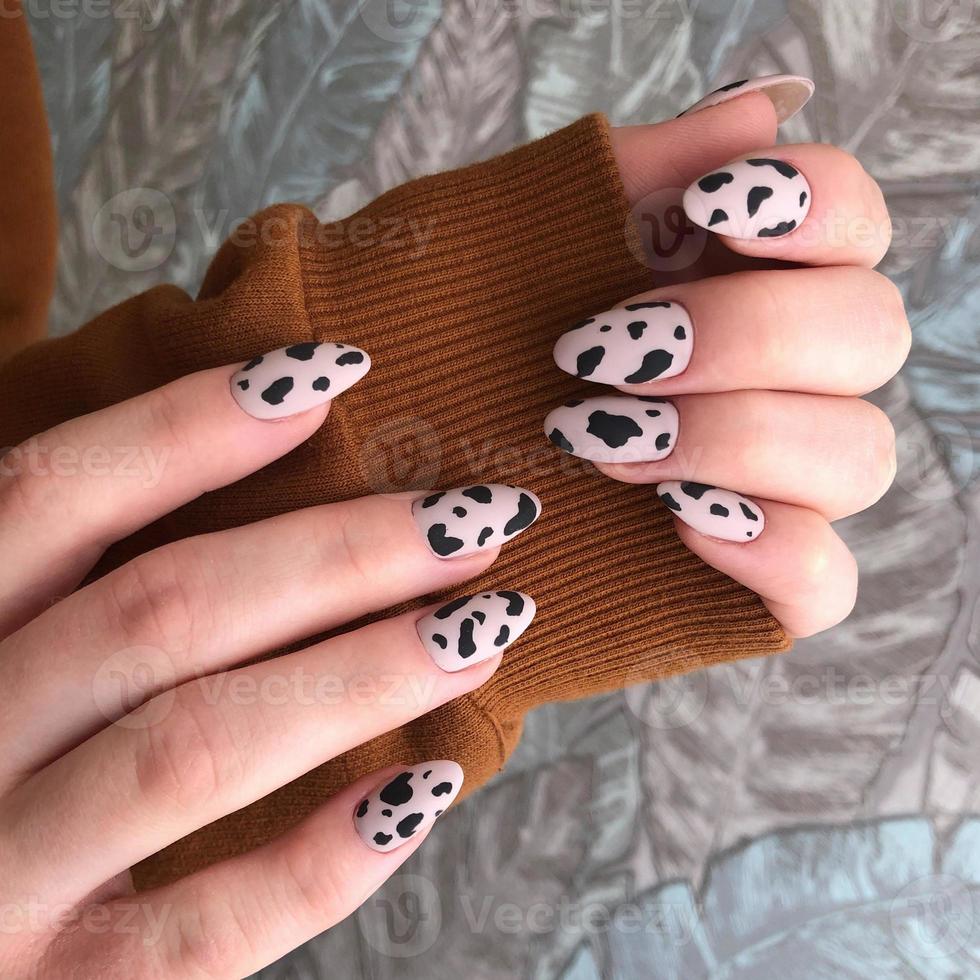 Female manicure with leopard design photo