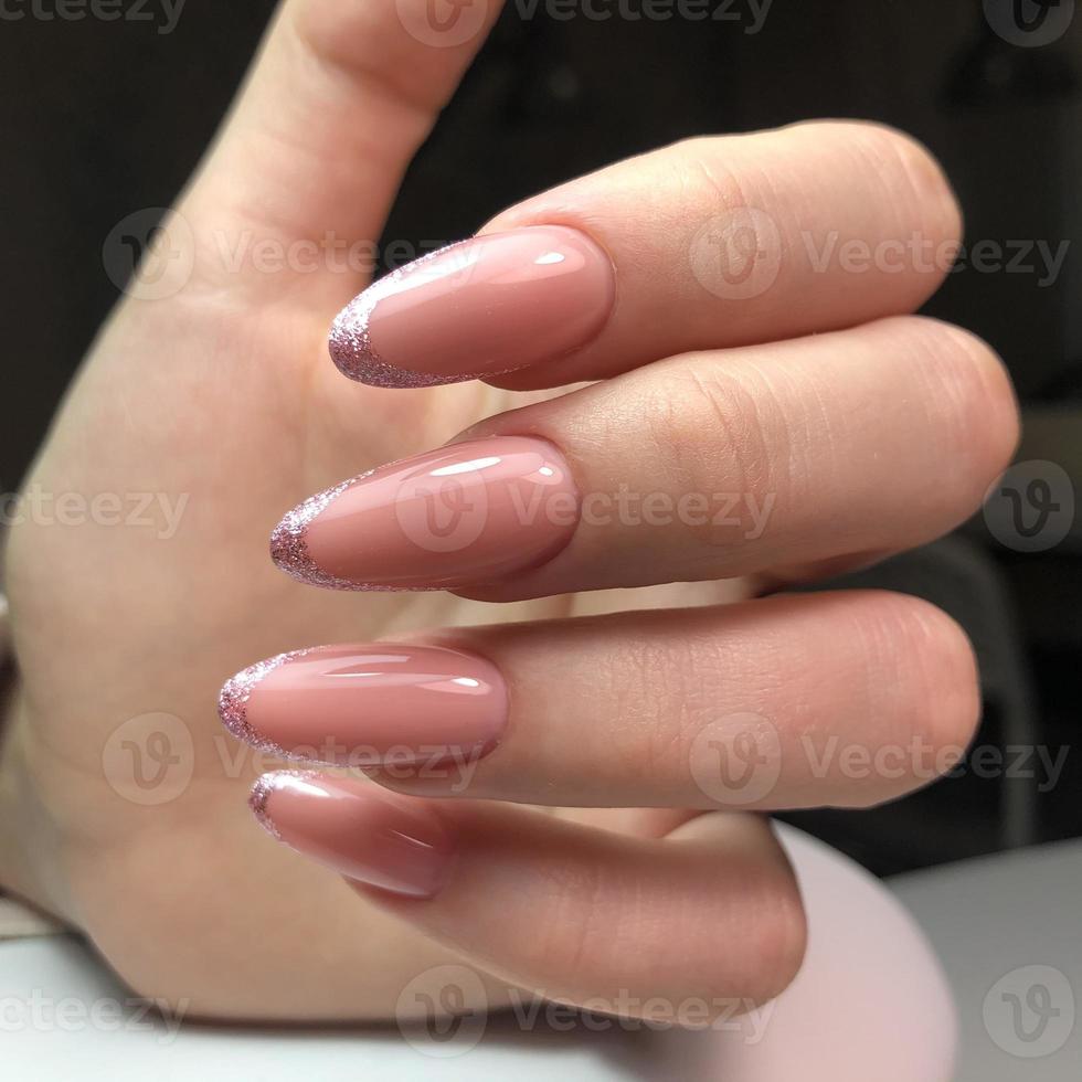 French manicure on the nails. French manicure design. Manicure gel nail polish photo