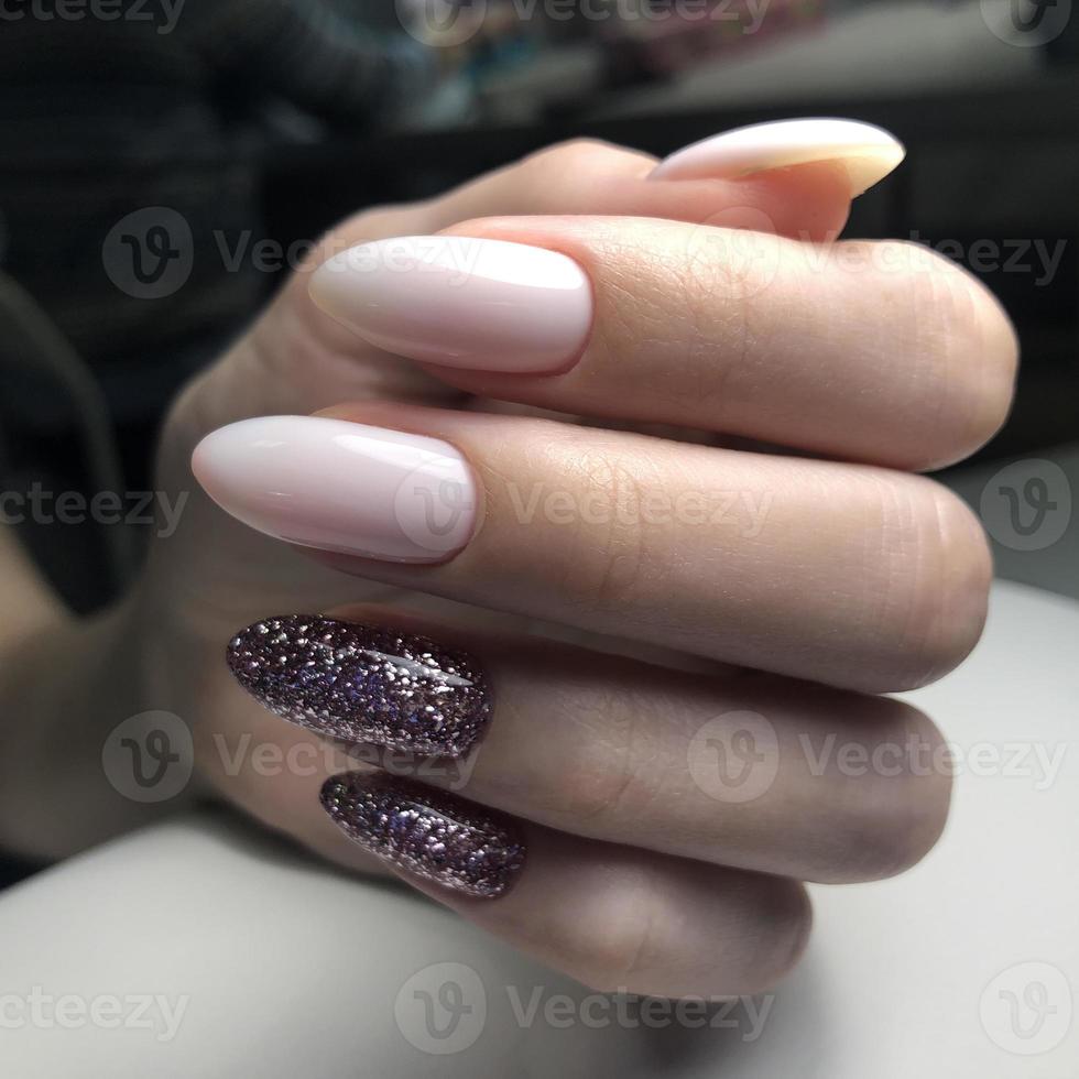 Bright multi-colored design of manicure.Multicolored manicure close up photo