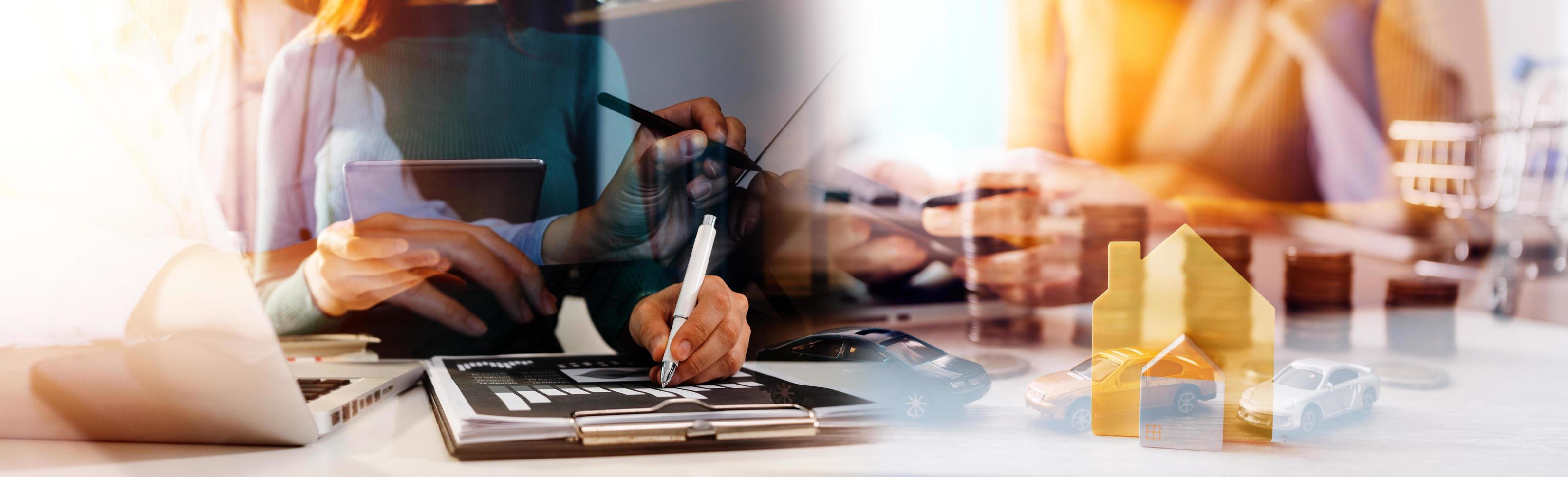Businessman hands working with finances about cost and calculator and laptop with tablet, smartphone at office in morning light photo