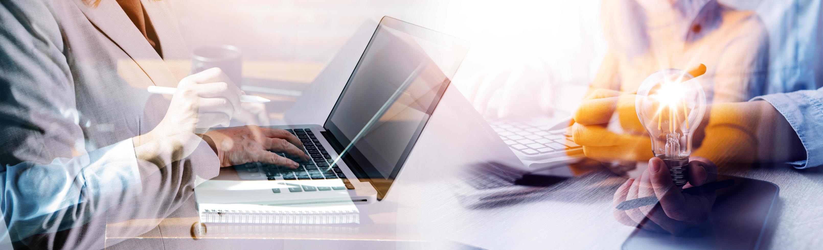 Businessman hands working with finances about cost and calculator and laptop with tablet, smartphone at office in morning light photo