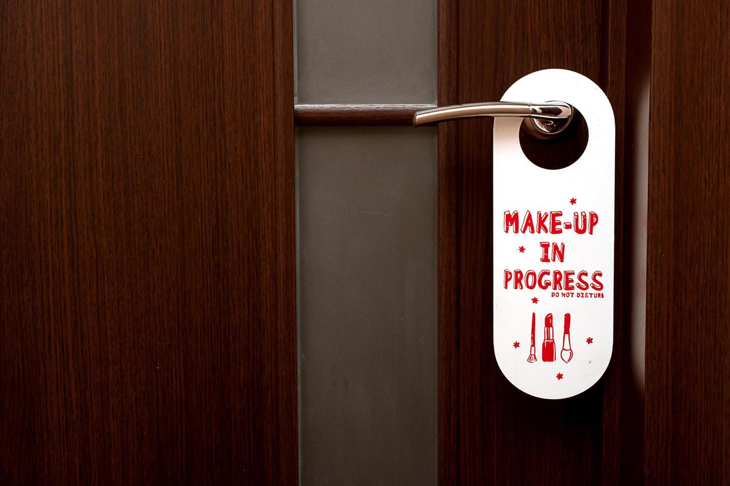 closed door, a sign on the handle Do Not Disturb Make-up in Progress photo