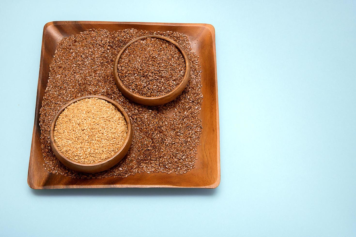 white and brown flax seeds in a wooden bowl 12622995 Stock Photo at