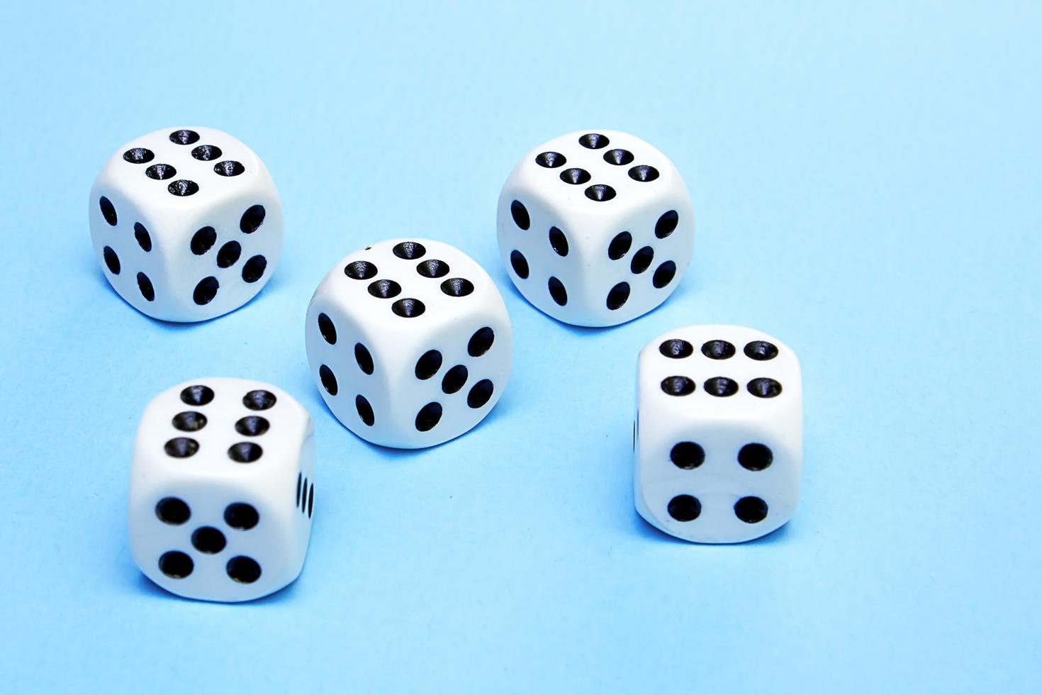 dice for the game with the same dropped out number on a blue background photo