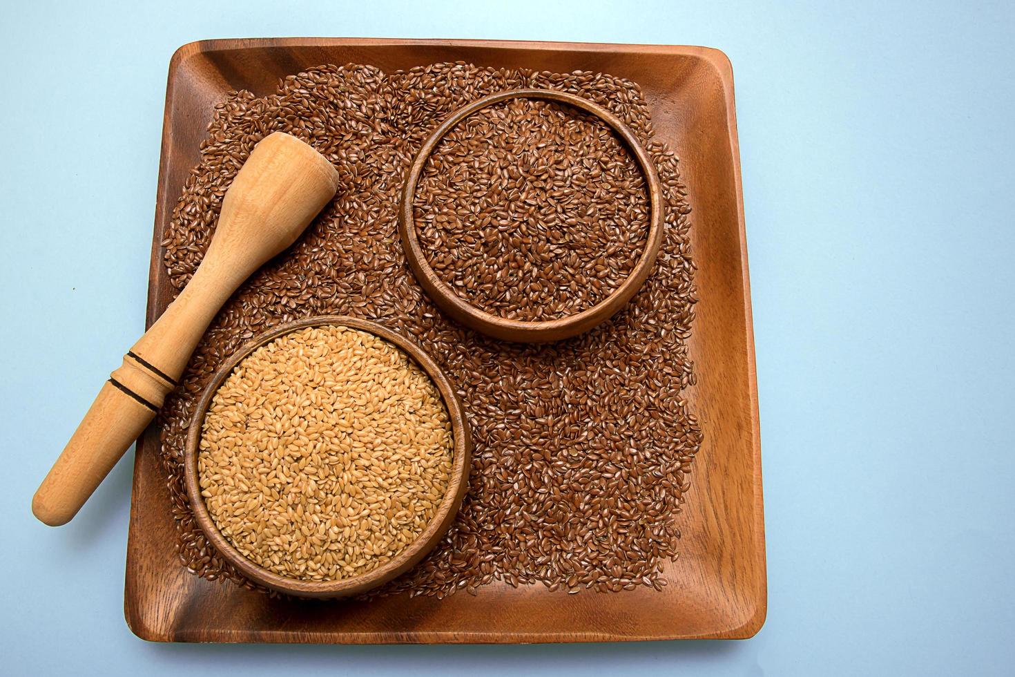 white and brown flax seeds in a wooden bowl 12623057 Stock Photo at