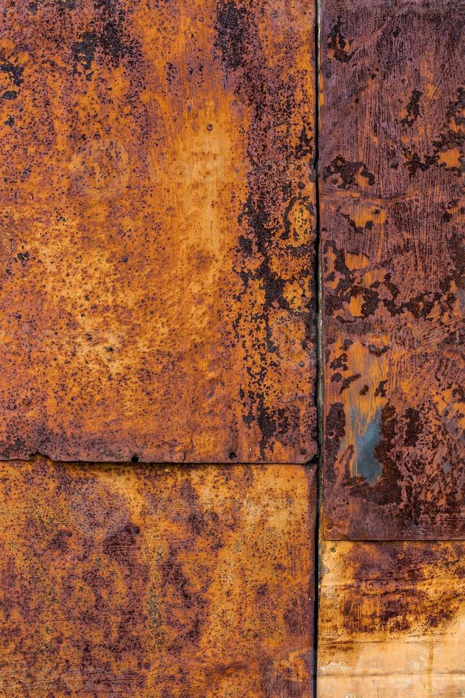Rusted flat composite nailed metal sheets surface background and texture. photo