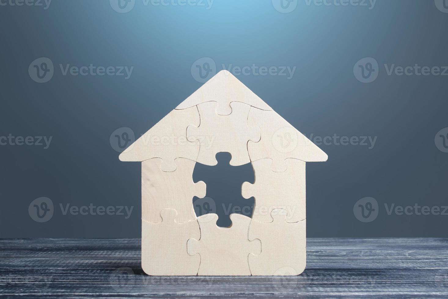 Puzzle house with a missing piece. The acquisition or construction comfortable dream home. Mortgage loan purchase real estate. Arrangement premises repair. Availability and cheapness. Finish building photo