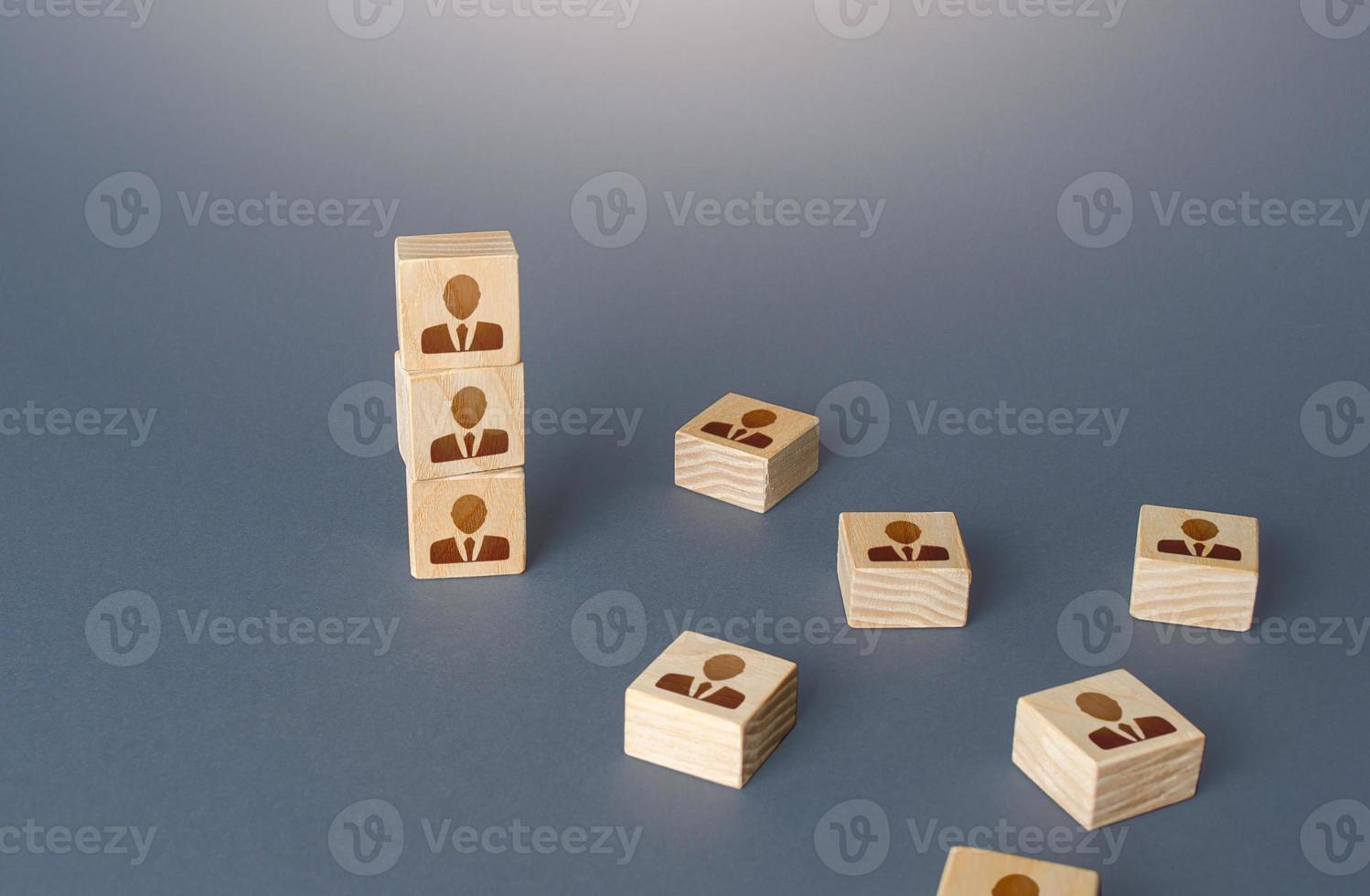 Figurine block tower with people. Hierarchical system. Company organization. Hiring, recruiting. Team building personnel leadership. Effective productive business employees group collectives. photo