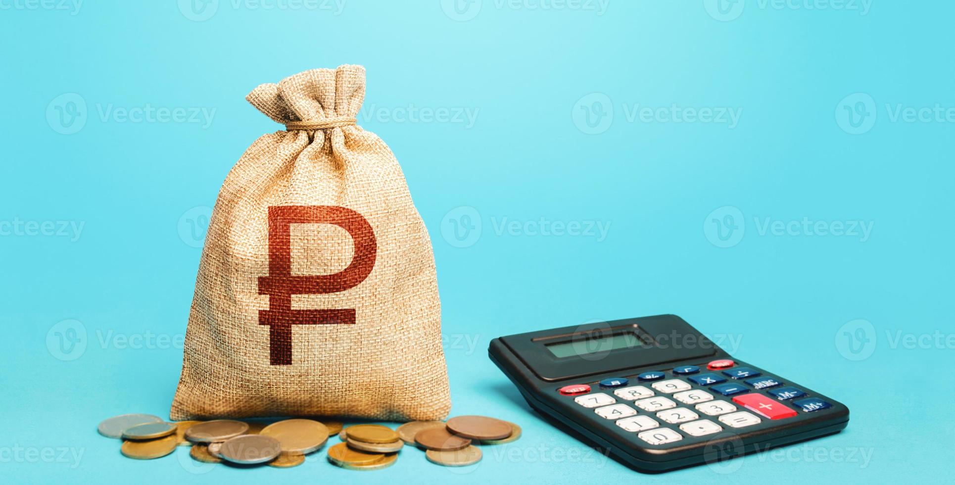 Russian ruble money bag and calculator. Accounting concept. Budgeting. Summing up the financial results. Calculation of damage and insurance payments. Analysis of loan selection. photo