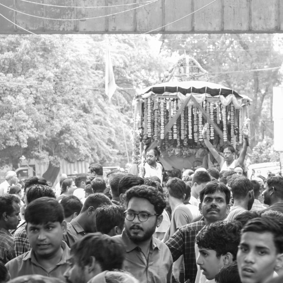 New Delhi, India July 01 2022 - A huge gathering of devotees from different parts of Delhi on the occasion of ratha yatra or rathyatra. Rath for Lord Jagannath pulled by people, Jagannath Rath Yatra photo