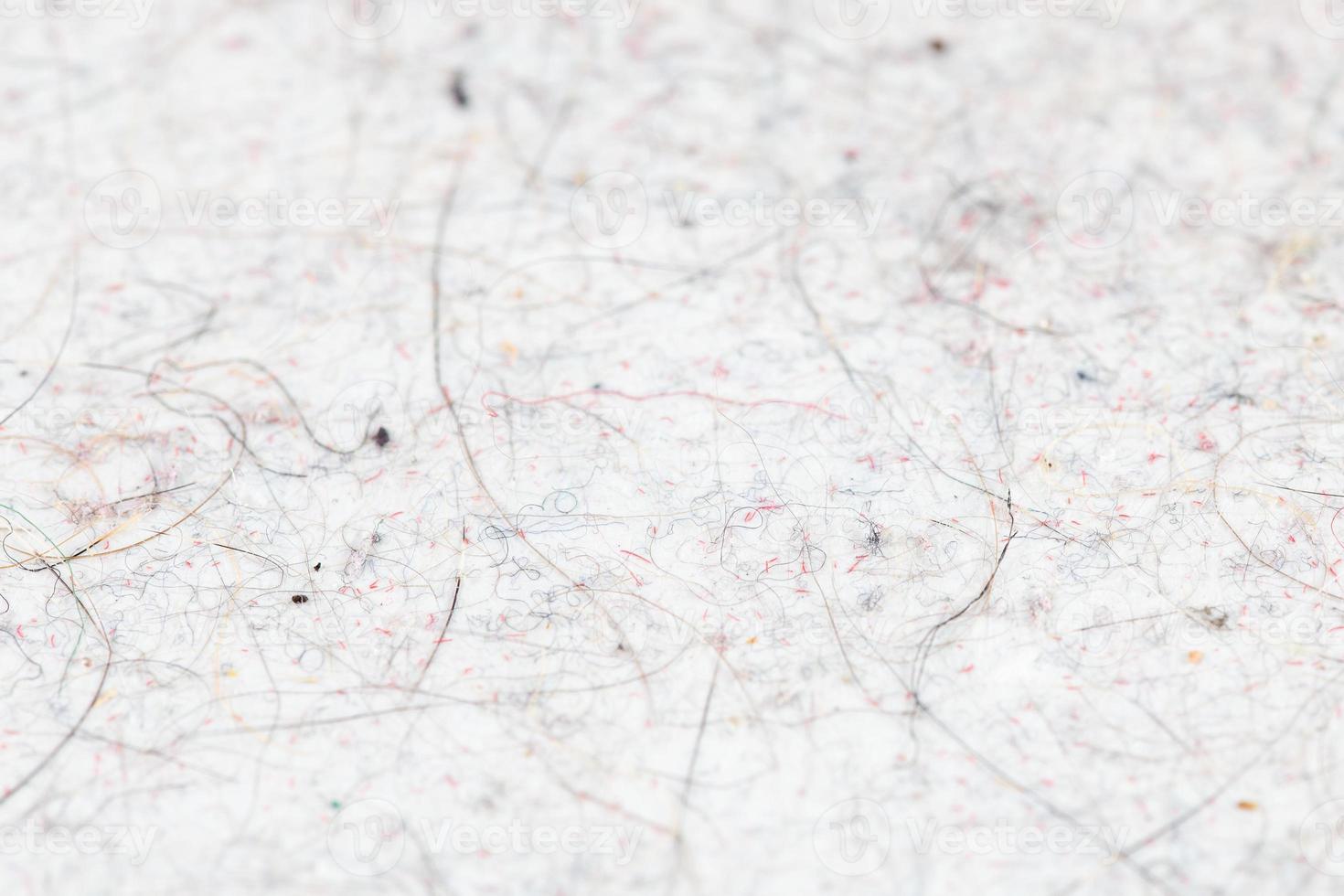 cat hair, fur and dust pollution on white flat surface closeup with