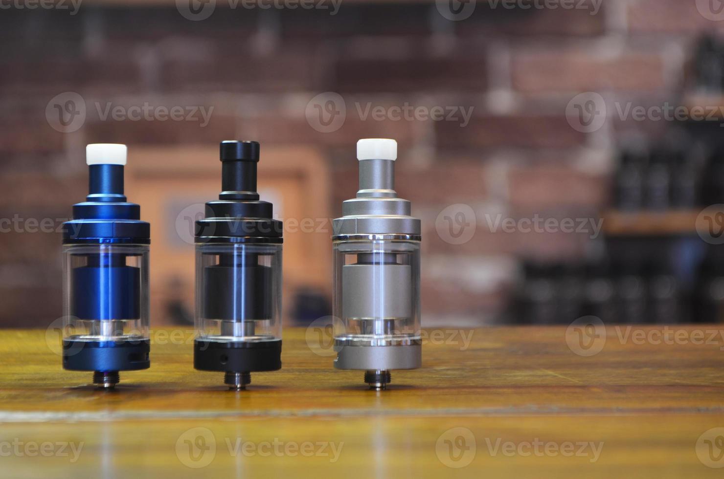Electronic cigarette on a background of vape shop. E-cigarette for vaping. photo