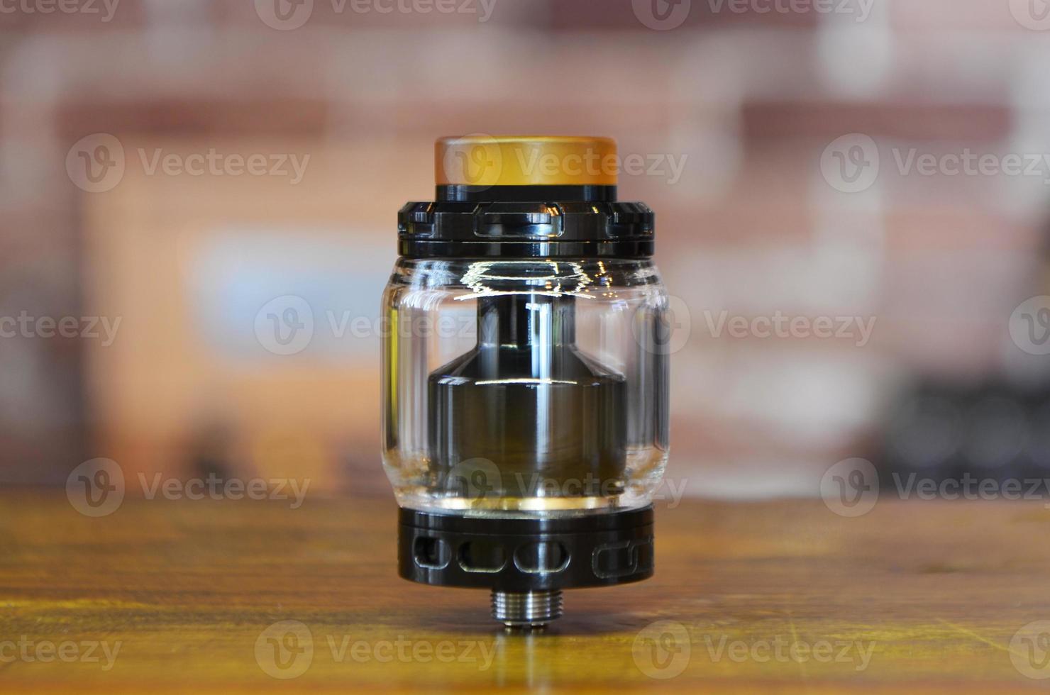 Electronic cigarette on a background of vape shop. E-cigarette for vaping. photo