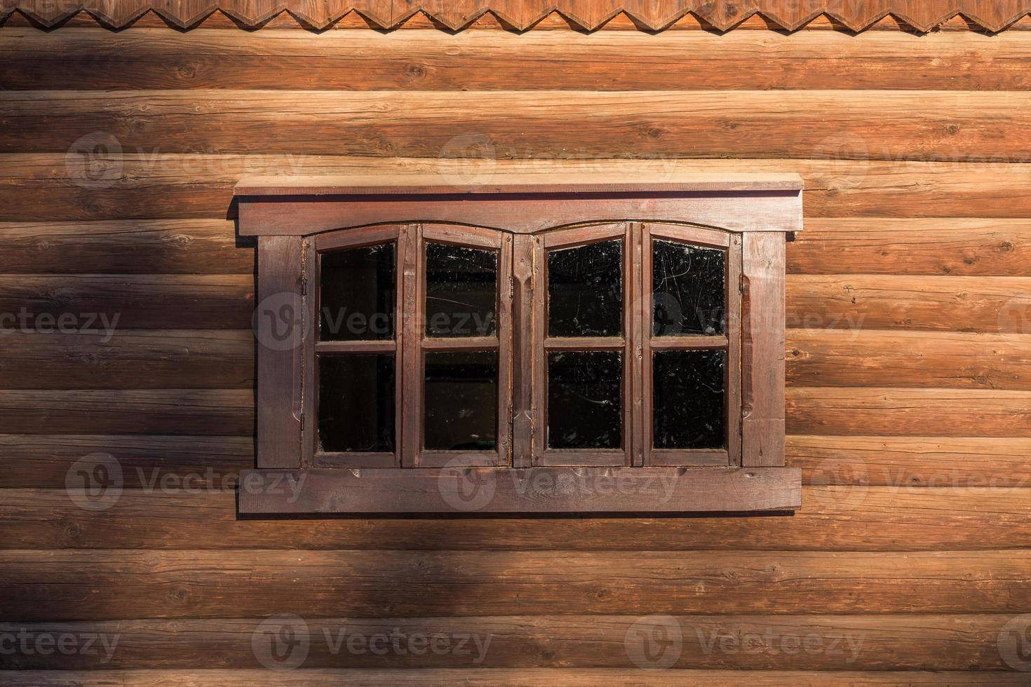 log wall with one centered window photo