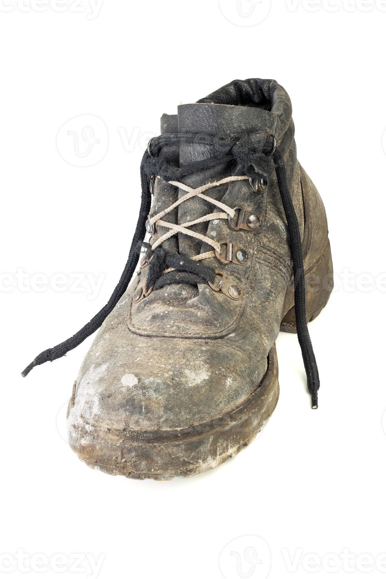 wornout old work boot, isolated on white background with shadow