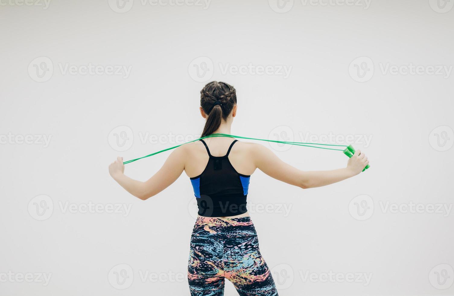 athletic woman posing in the gym photo