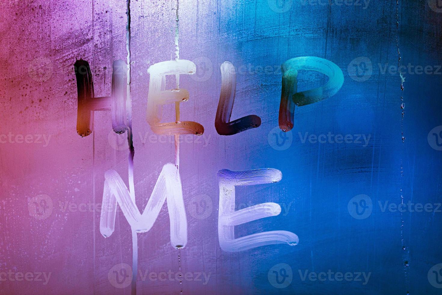 words help me handwritten on night wet window glass with purple and blue color gradient photo