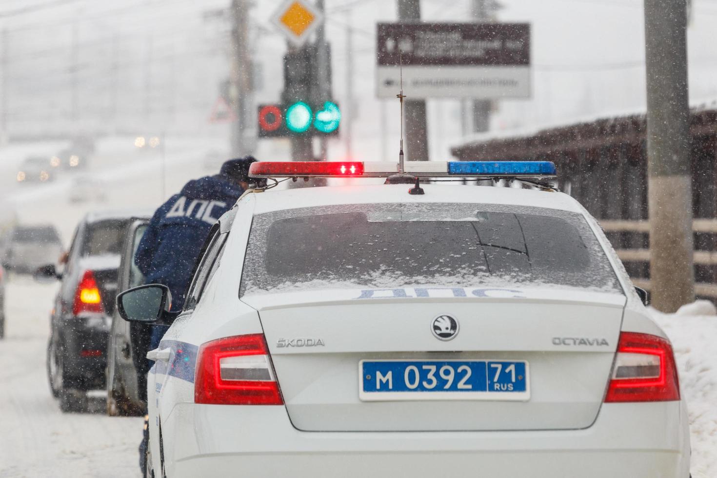 Tula, Russia February 13, 2020 Russian police car at winter snowfall at day light, abbreviation DPS means Road Patrol Service photo
