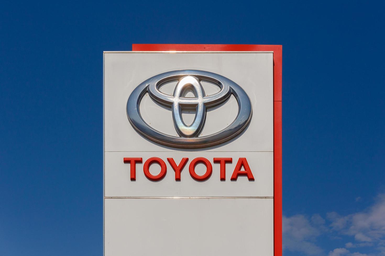 Toyota logo on promotional stand at sunny day - Toyota Motor Corporation is a Japanese automotive manufacturer. photo