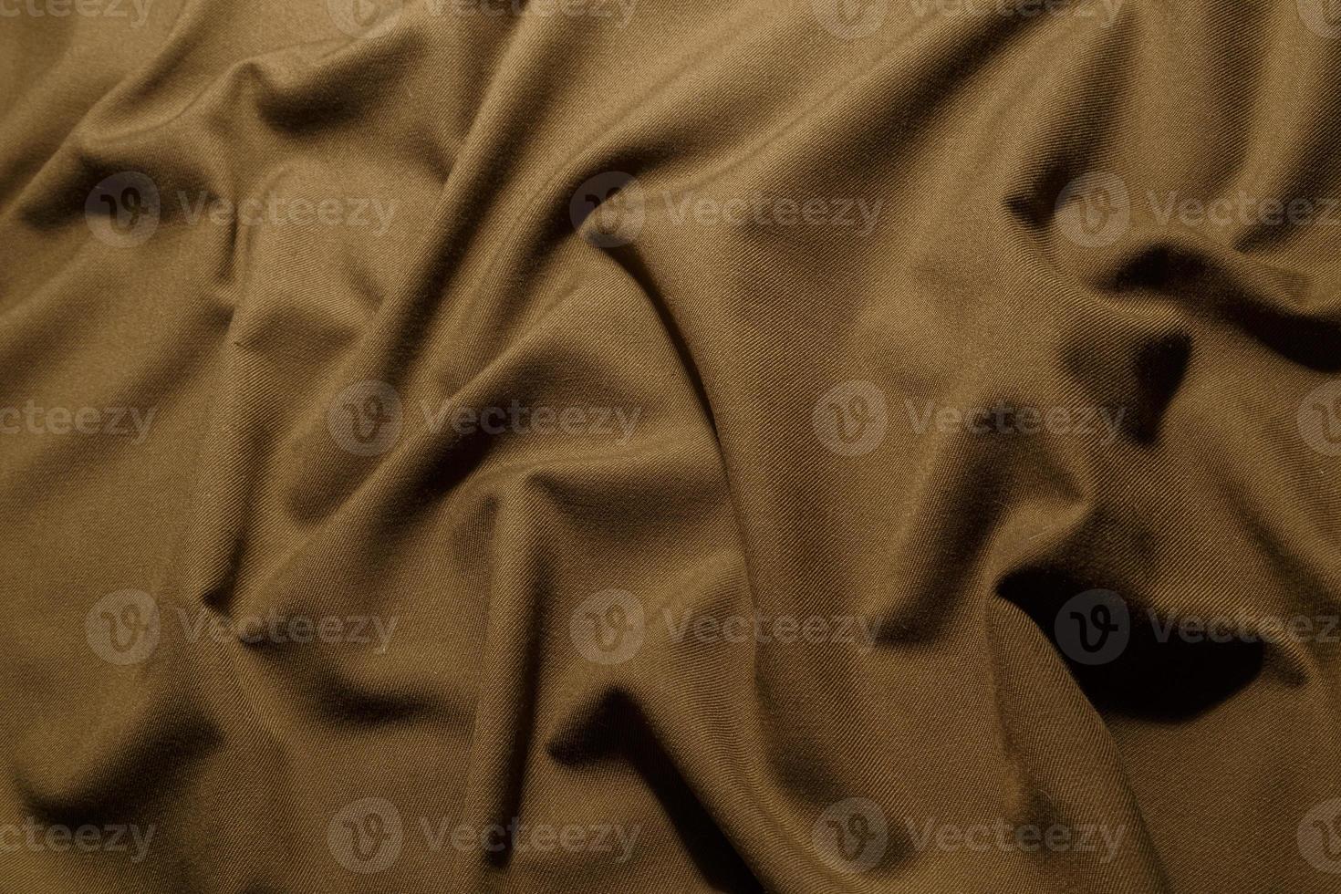 crumpled khaki tan crumpled tan khaki canvas fabric - full frame background and texture photo