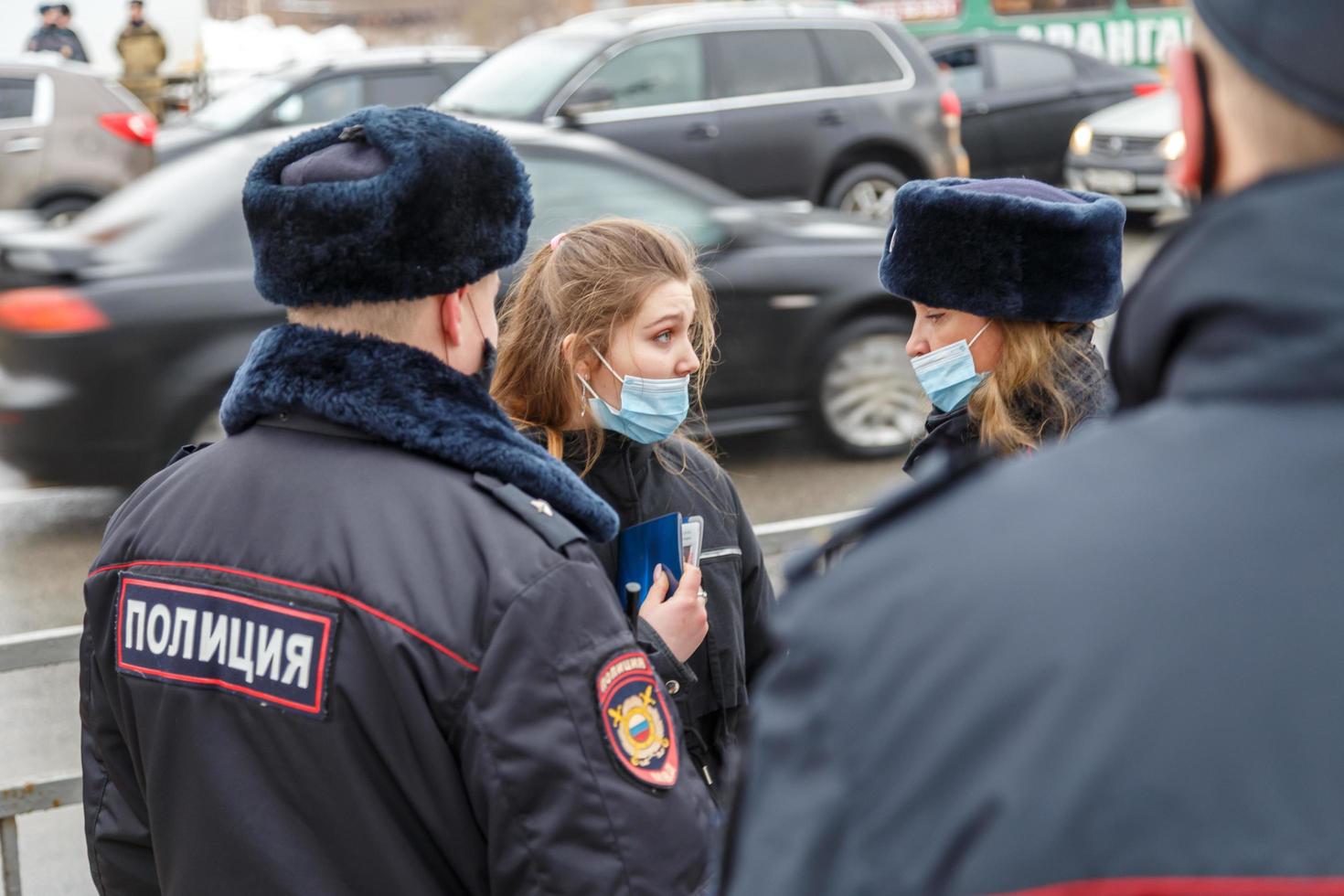 TULA, RUSSIA JANUARY 23, 2021 Public mass meeting in support of Alexei Navalny, pretty underage girl argues with the police. photo