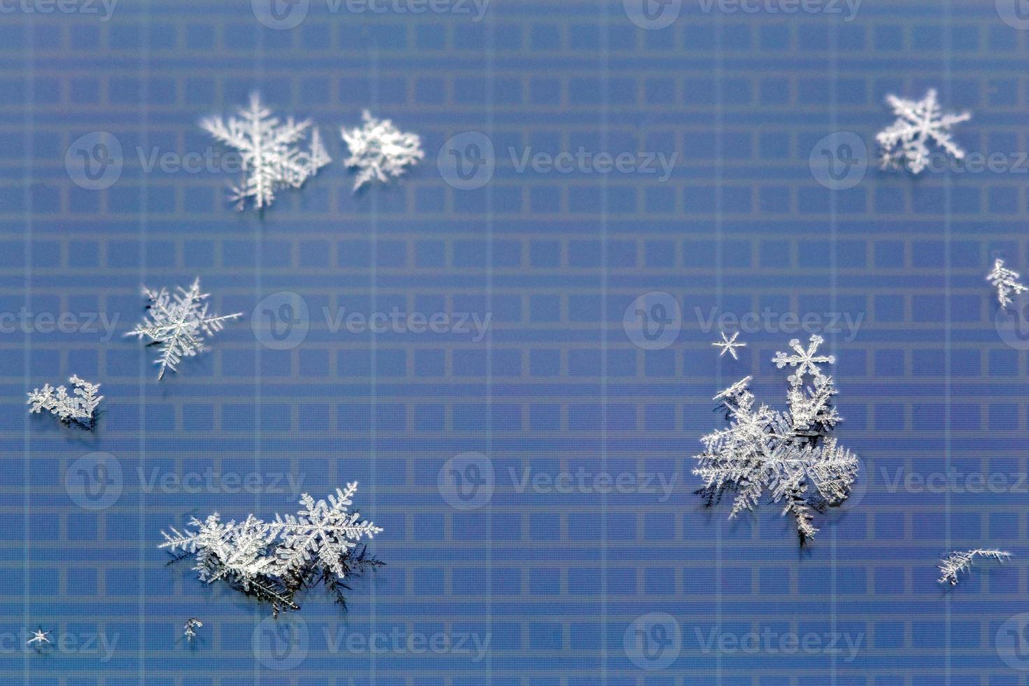 snowflakes on LCD screen of mobile phone macro background photo