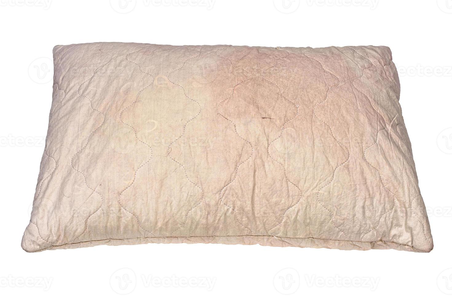 dirty used spotted pillow isolated on white background in slanted frontal perspective photo