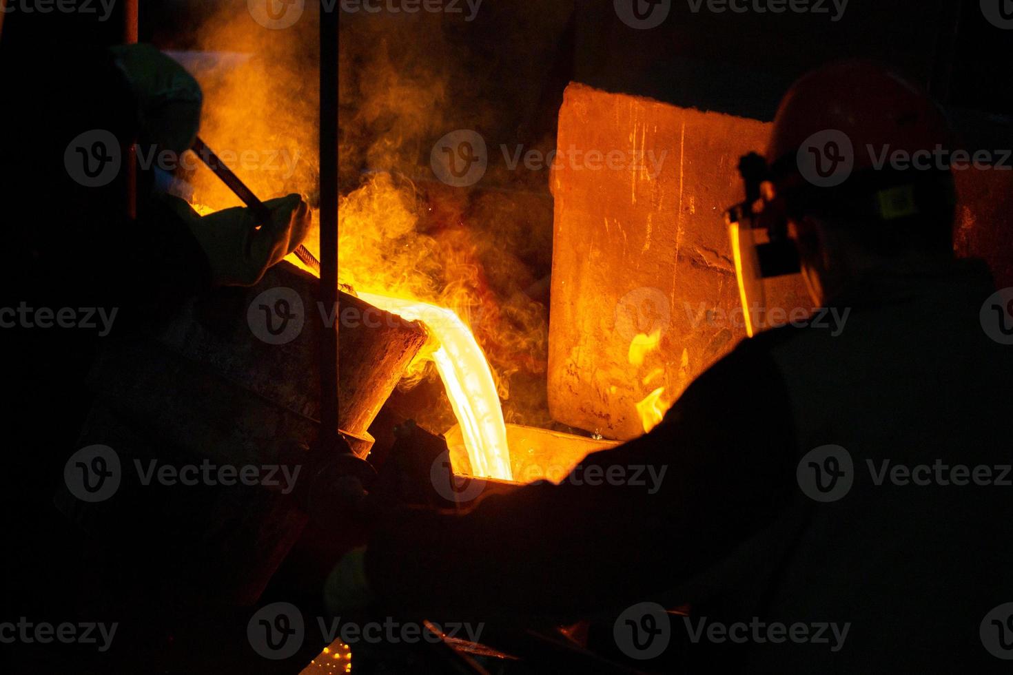 Close-up view of industrial chill casting. The process of for filling out mold with molten metal. photo