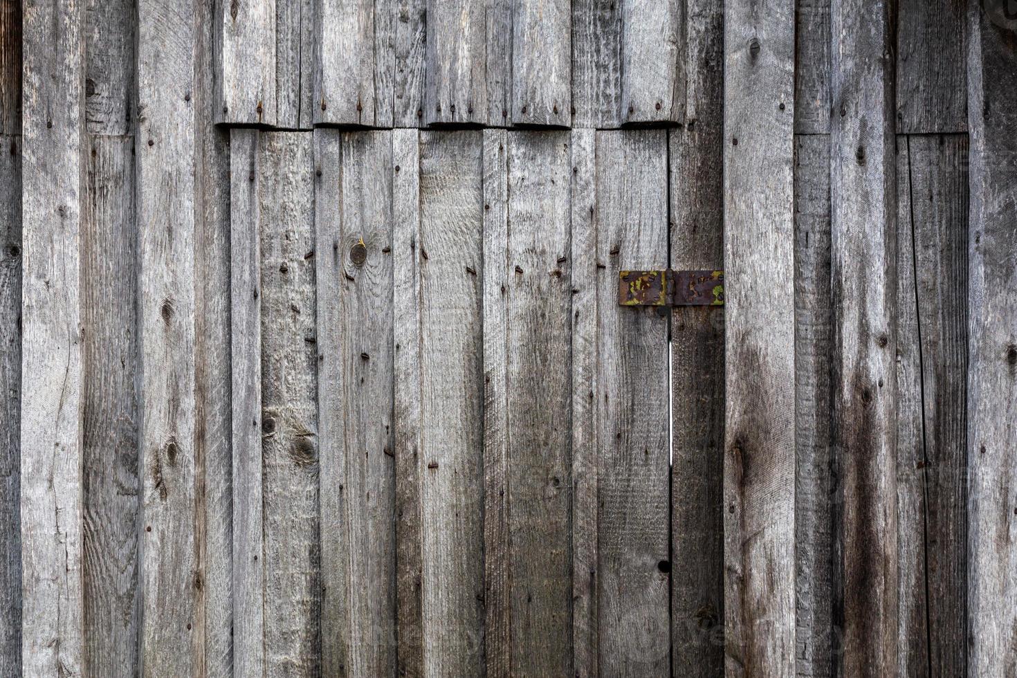 Fondo y textura de superficie de tablero de tablones verticales de madera gris foto