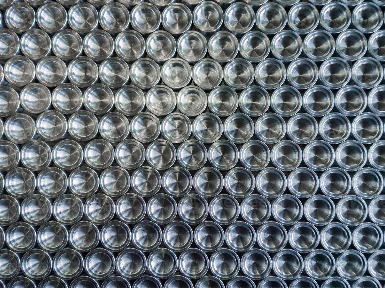 Shiny metal parts after cnc turning, on flat surface flat lay background photo