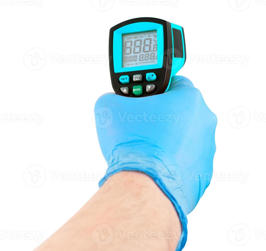 hand in blue medical latex glove aiming with blue infrared contactless thermometer isolated on white background, mockup display state with all on photo