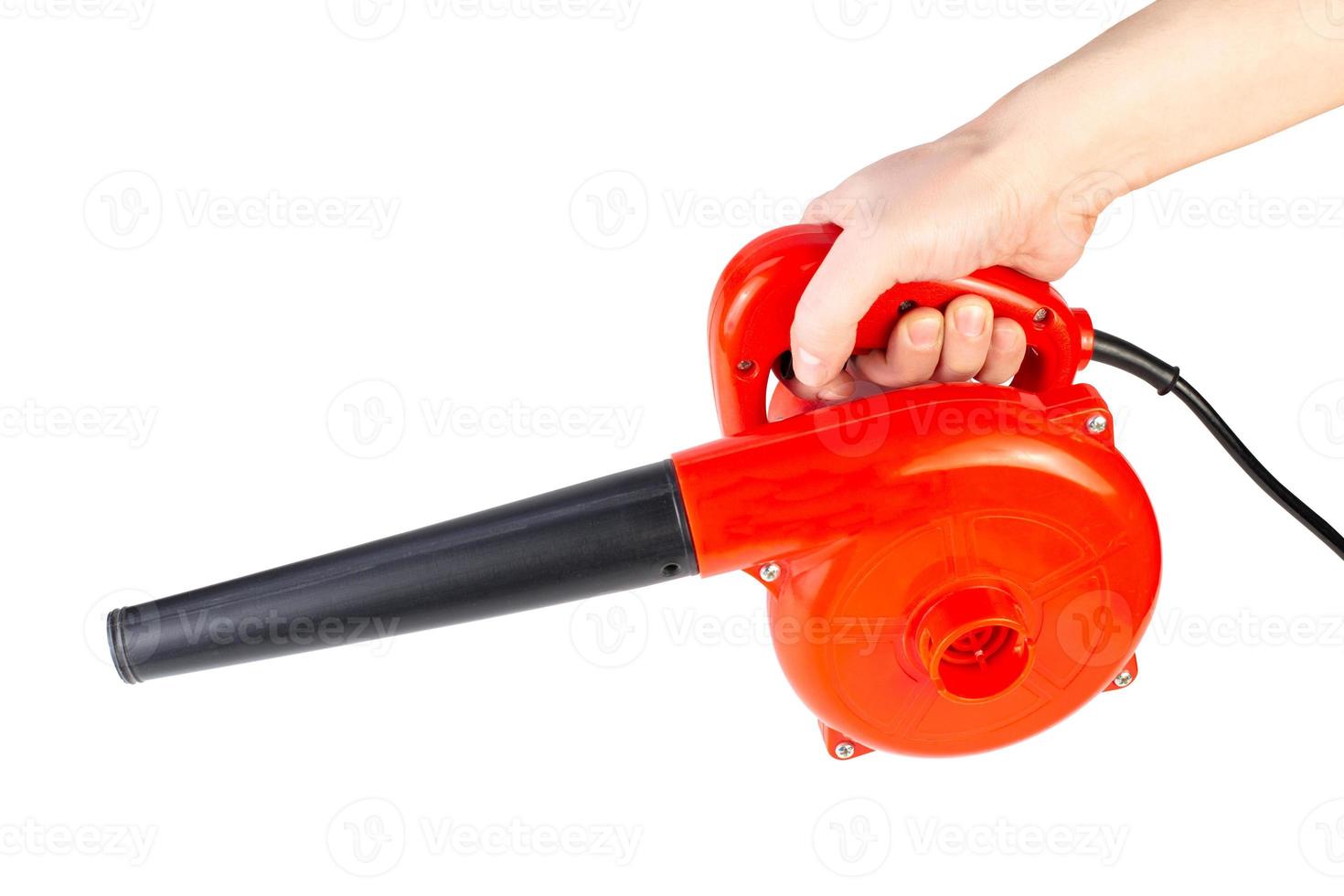 hand holding red electrical air dust blower isolated on white