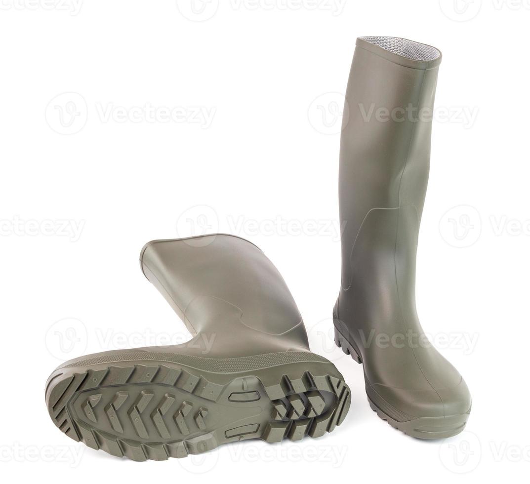 A pair of clean green rubber boots isolated on white background photo