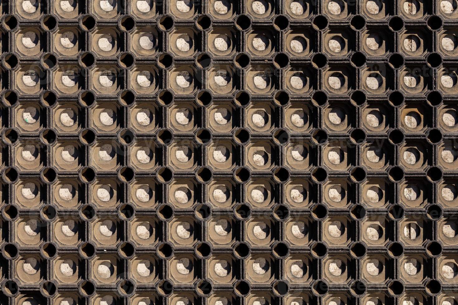 texture and background of used dusty cellular rubber floor mat photo