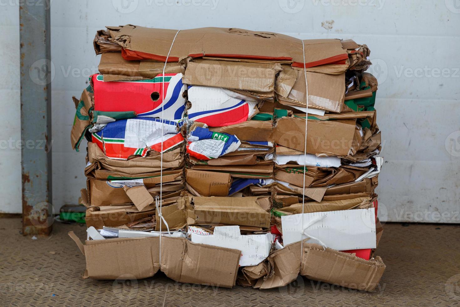 medium size compressed cardboard waste block bale 12628754 Stock Photo