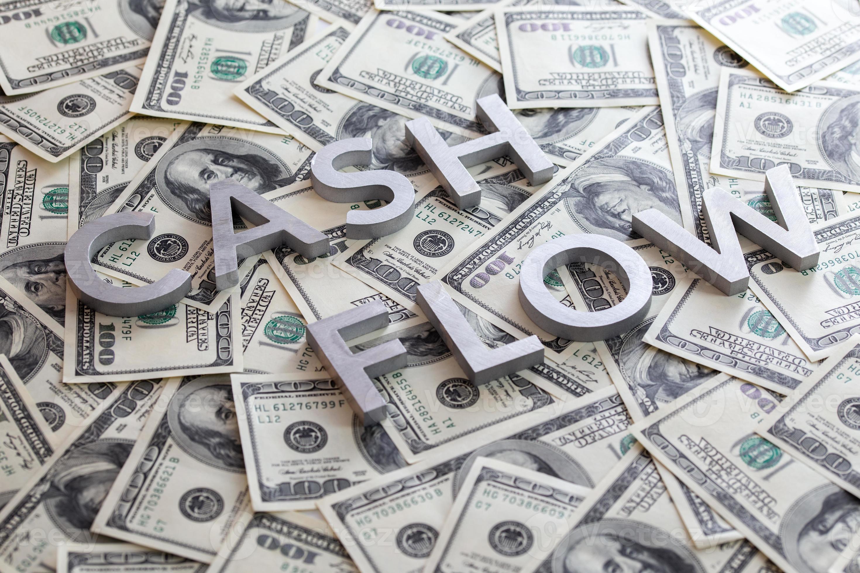 The Words CASH FLOW Laid With Aluminium Letters On The US Dollar 