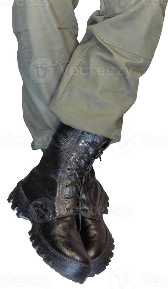 Legs in army khaki pants and military boots photo