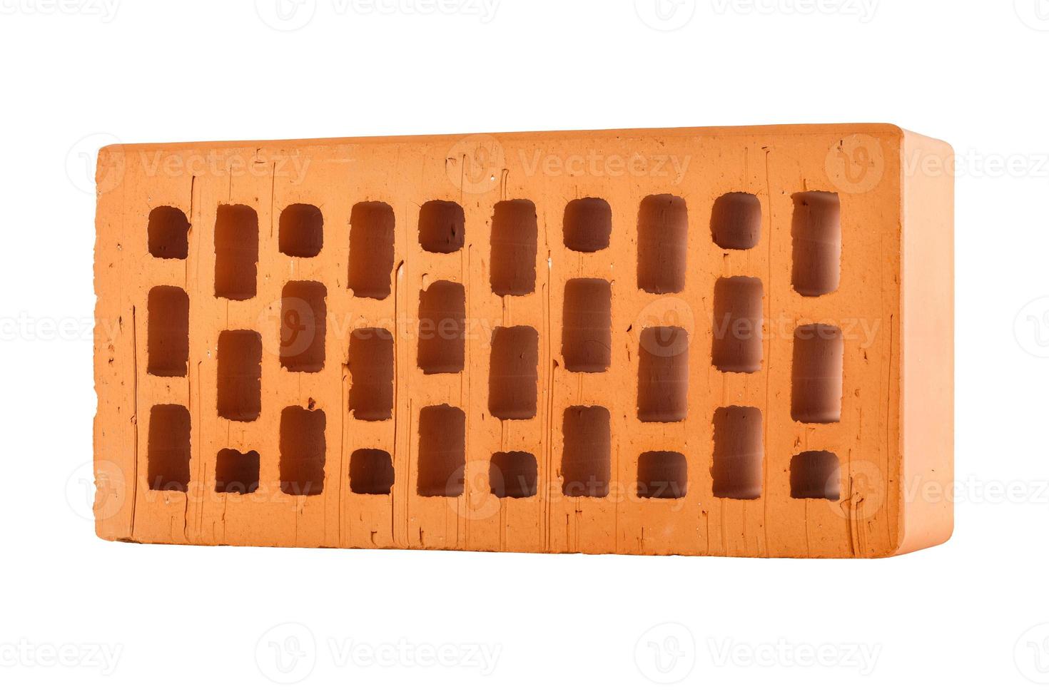 Perforated red brick isolated on white background photo