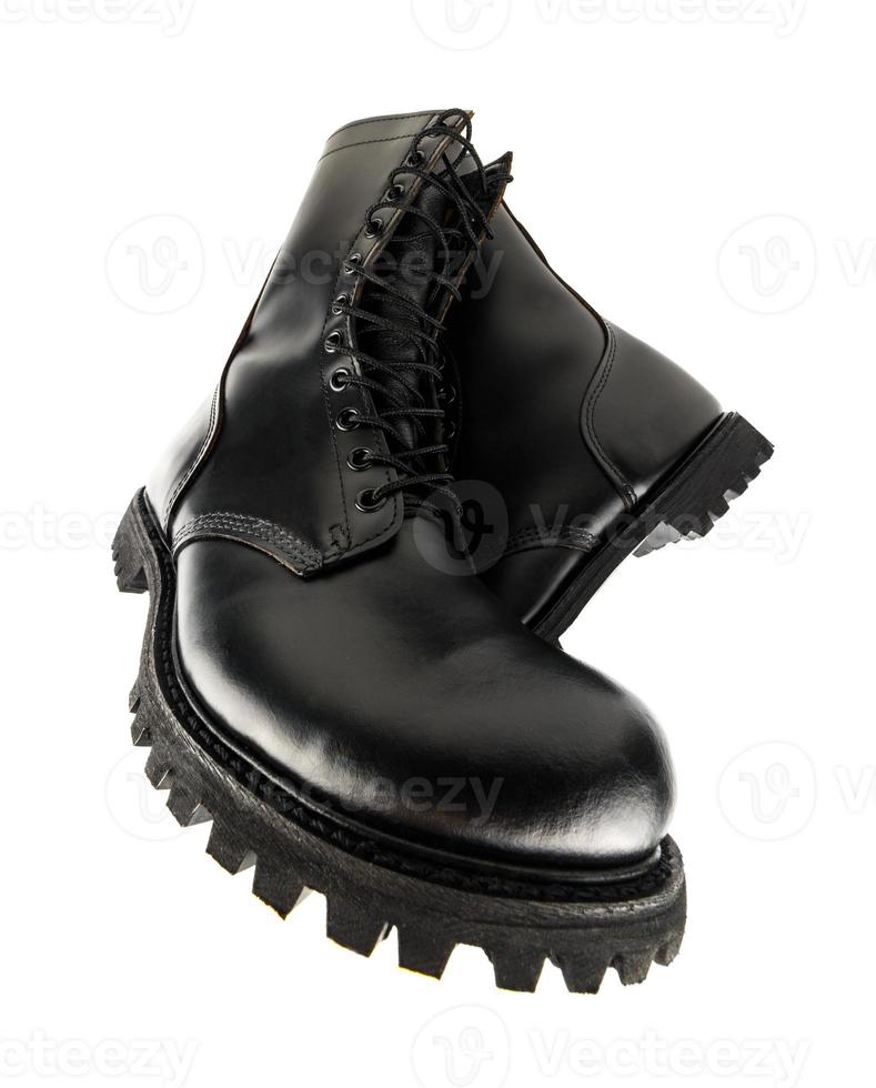 ultra wide angle view on pair of black leather 10-inch new military combat boots, isolated on white background photo