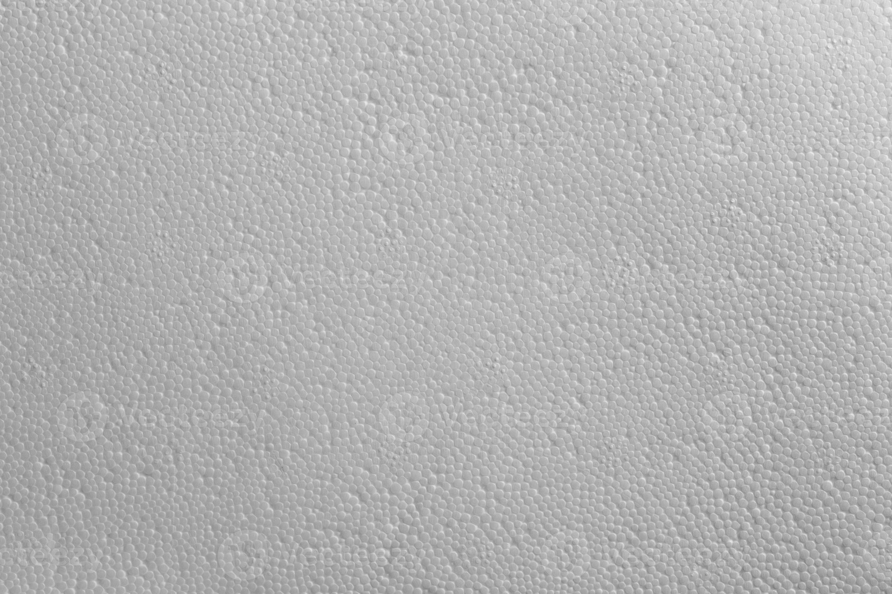Seamless texture of white polystyrene foam or styrofoam, closeup flat