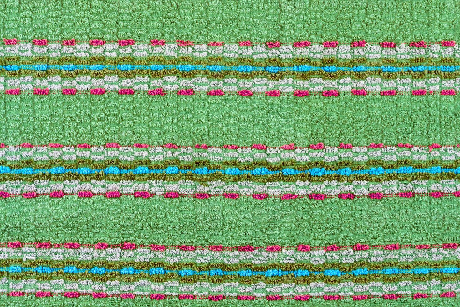 old turquoise towel with horizontal stripes ornament - flat background and texture photo