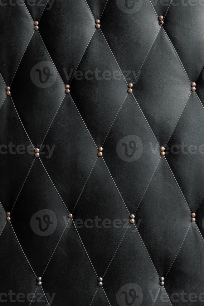 Soviet soft black dermantine front door with a banner of fishing line and nails - full frame background and texture photo