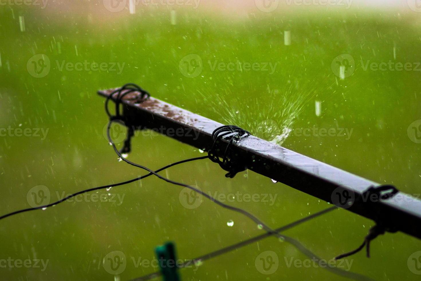 Old balcony clothes drying ropes guide at rainy day close up photo