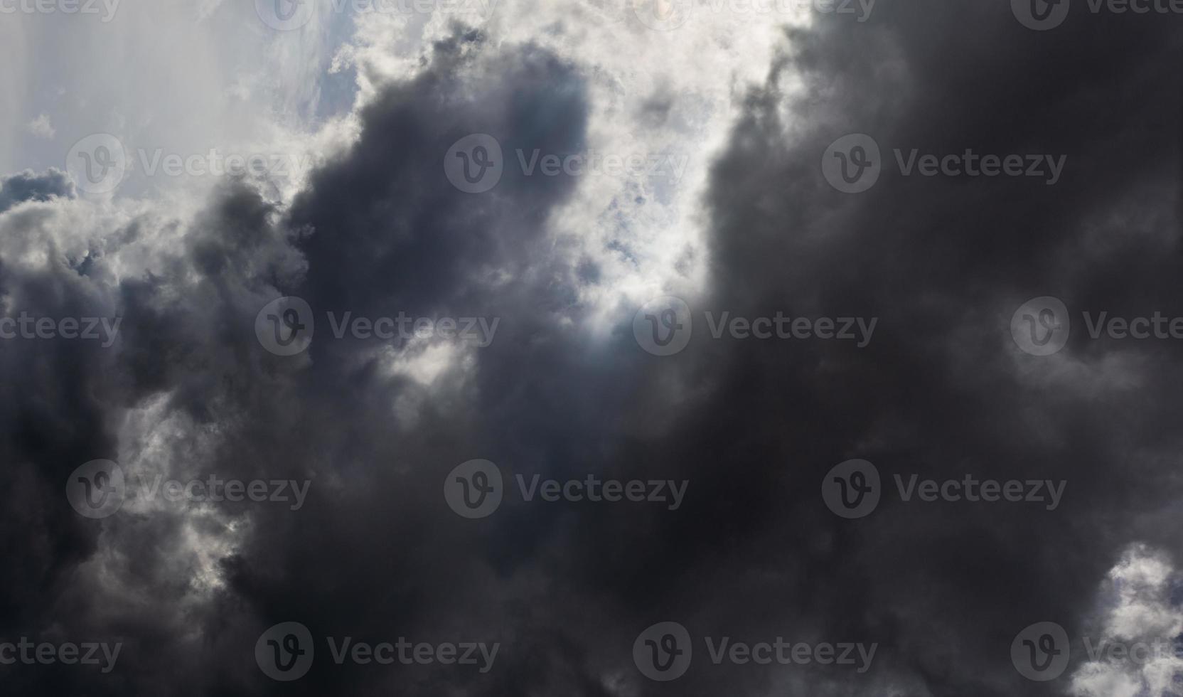 Grey summer storm clouds background. Zenith view from ground surface. photo