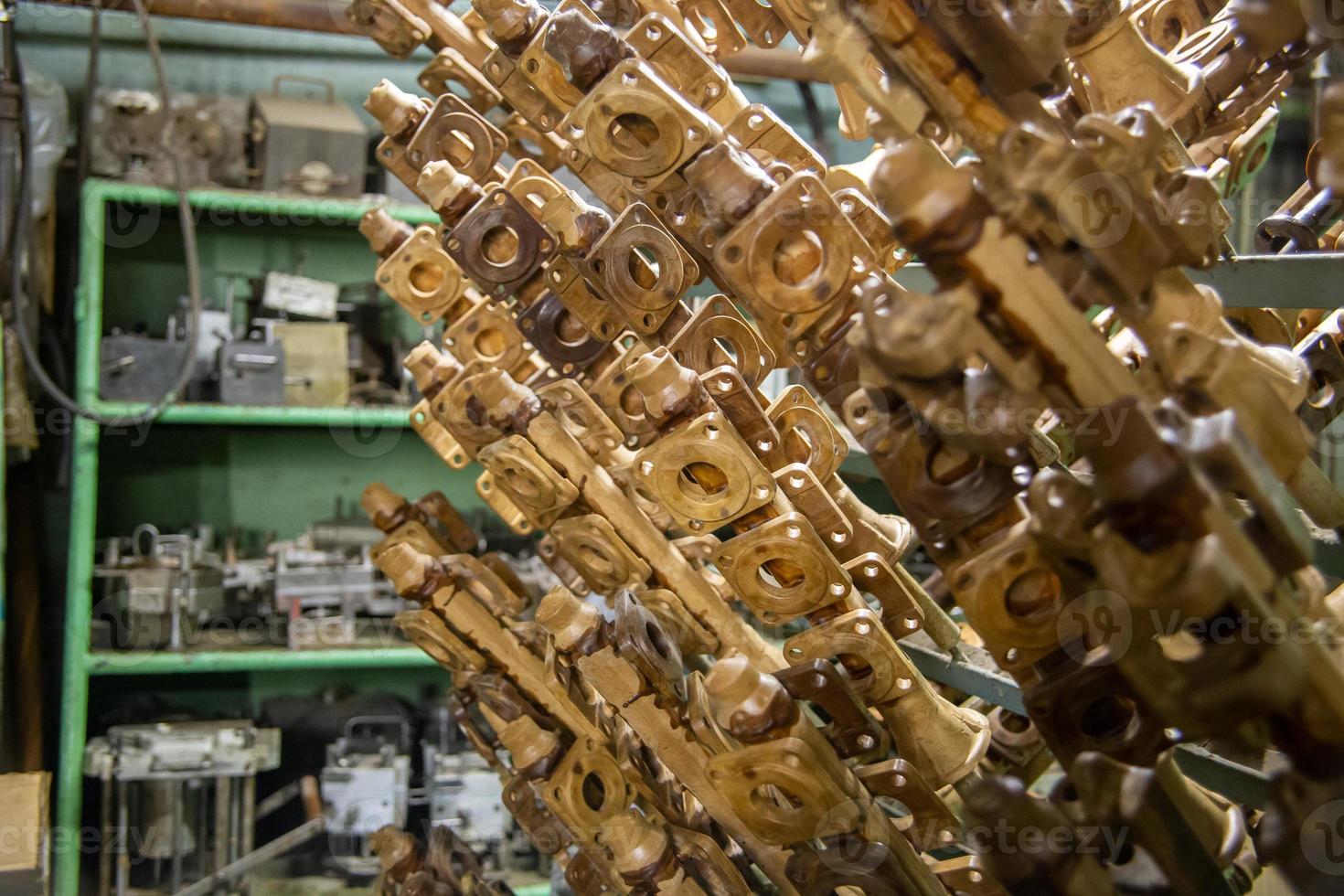 industrial lost wax models on sprue waiting for shell making, close-up with selective focus photo