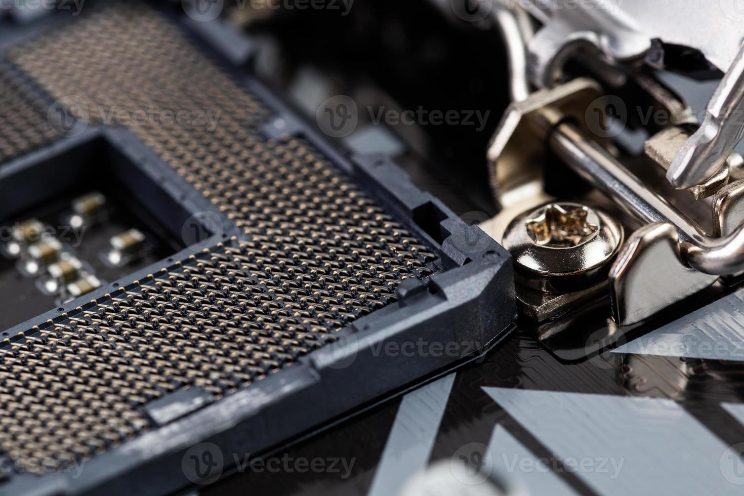 opened processor LGA slot on pc mainboard - closeup shot with selective focus photo