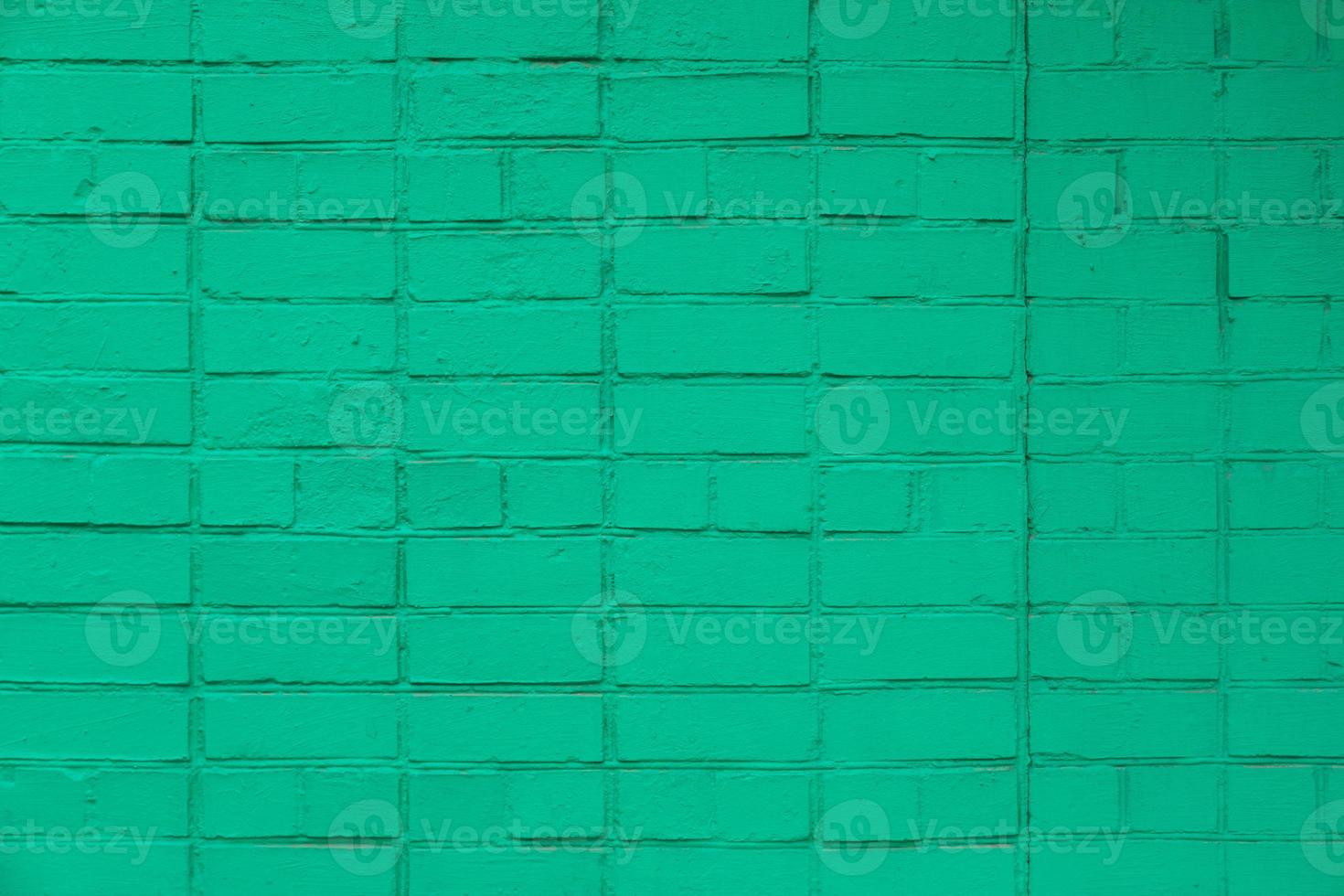 matte green painted brick wall full frame flat background and texture photo